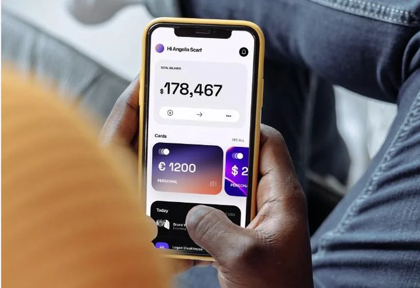 The Trillions app showing a total balance and card list