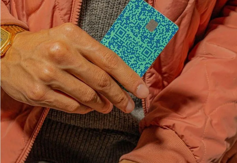 A Trillions card held in one hand